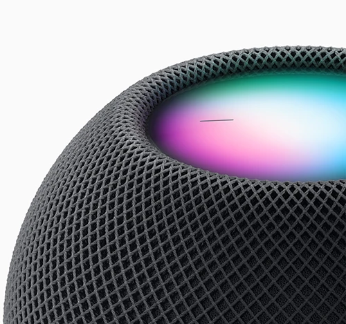 A close-up of Apple HomePod Mini showing the status light.